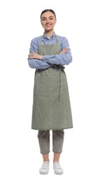 Beautiful young woman in clean apron on white background