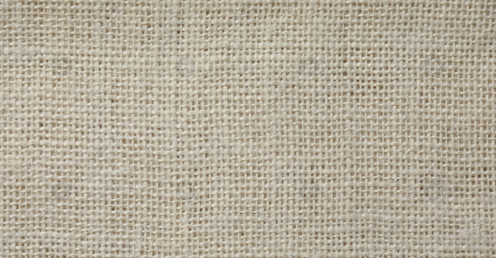 Photo of Texture of beige fabric as background, top view