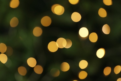 Photo of Abstract background with blurred yellow Christmas lights, bokeh effect