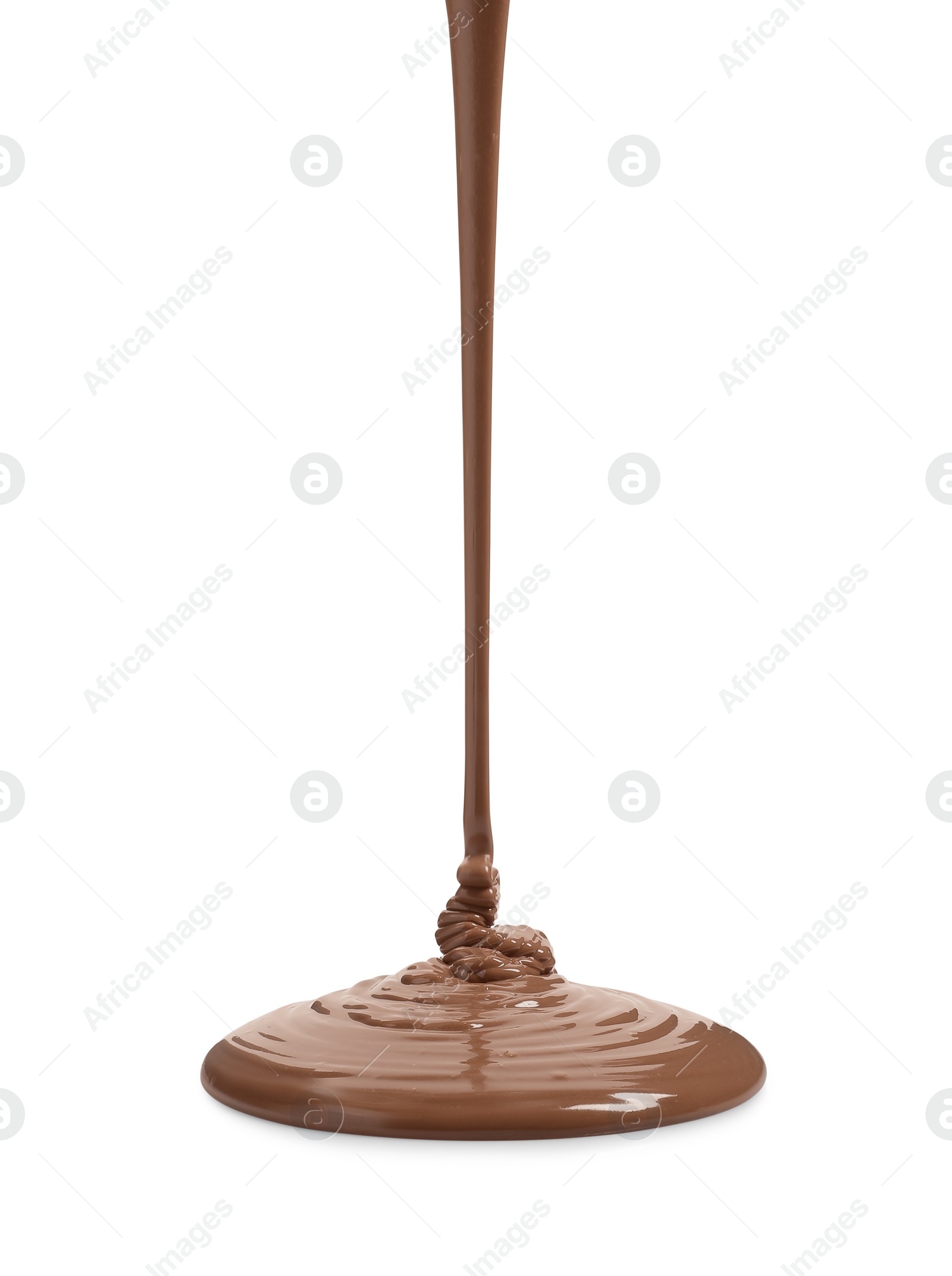 Photo of Pouring tasty melted milk chocolate isolated on white