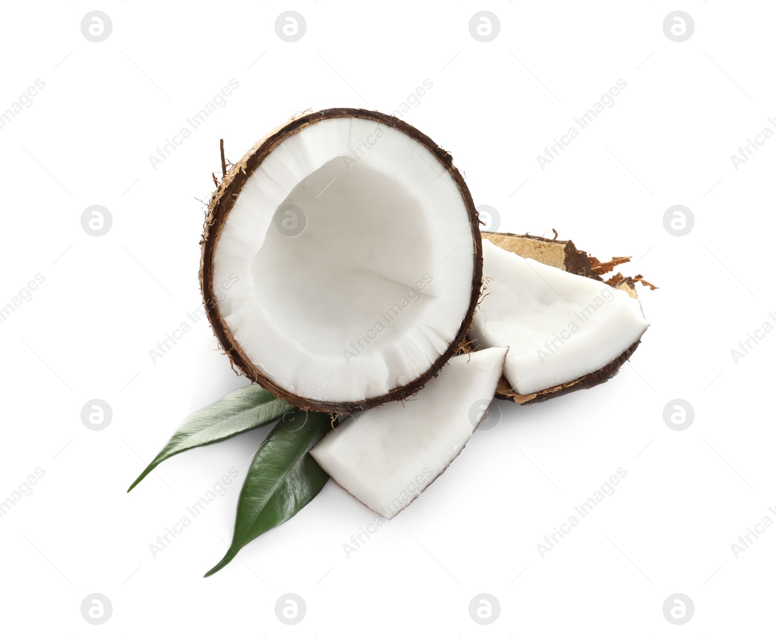 Photo of Ripe coconut with leaves on white background