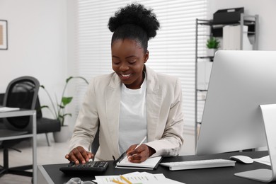 Photo of Professional accountant working at desk in office