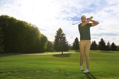 Photo of Man playing golf on green course, space for text