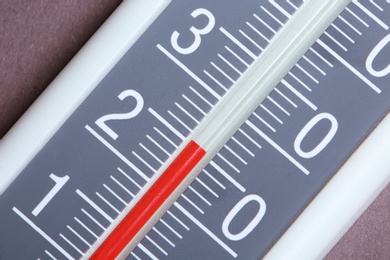 Photo of Weather thermometer on gray background, closeup view