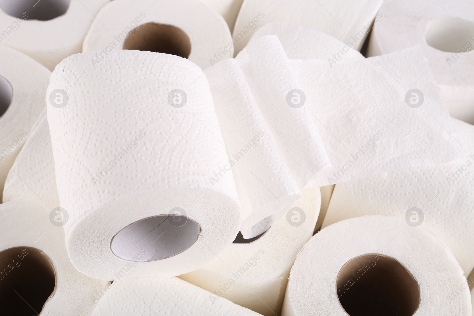 Photo of Many soft toilet paper rolls as background, closeup