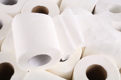 Photo of Many soft toilet paper rolls as background, closeup