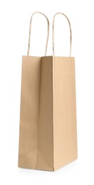Photo of One kraft paper bag isolated on white. Mockup for design