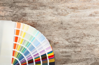 Photo of Color palette samples on wooden background