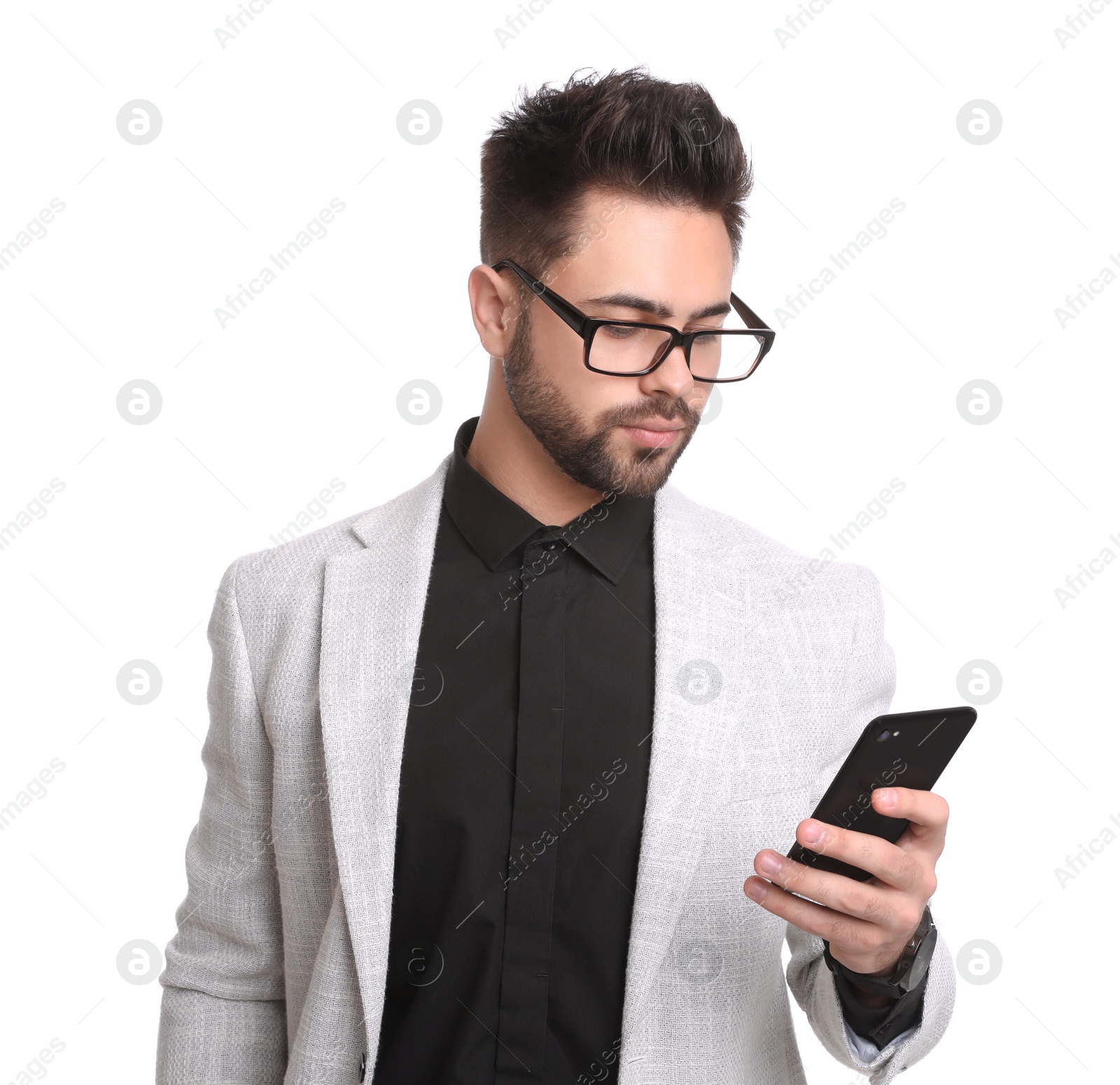 Photo of Young businessman with smartphone on white background