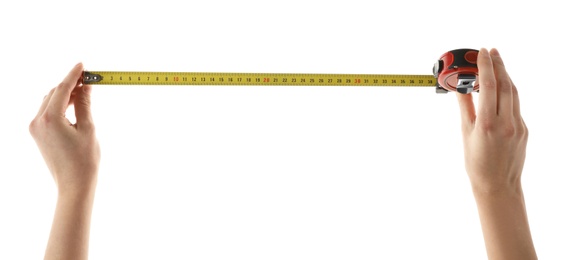 Photo of Woman holding tape measure on white background, closeup. Construction tool