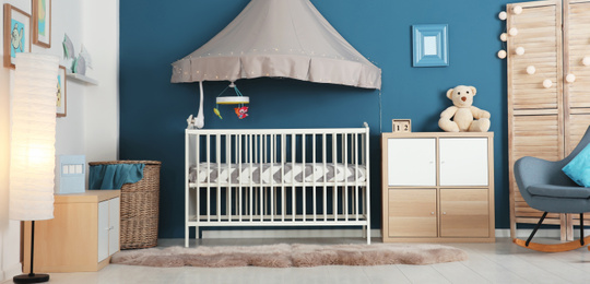 Image of Baby room interior with comfortable crib. Banner design