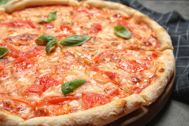 Photo of Delicious pizza Margherita on table, closeup view