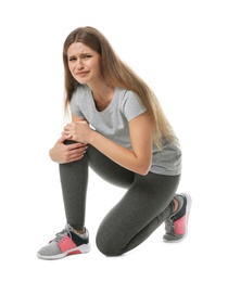 Photo of Full length portrait of sportswoman having knee problems on white background