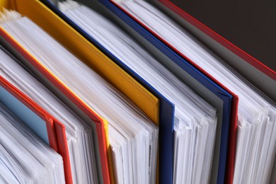 Photo of Colorful binder office folders as background, closeup