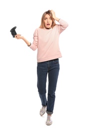 Photo of Emotional young woman playing video games with controller isolated on white