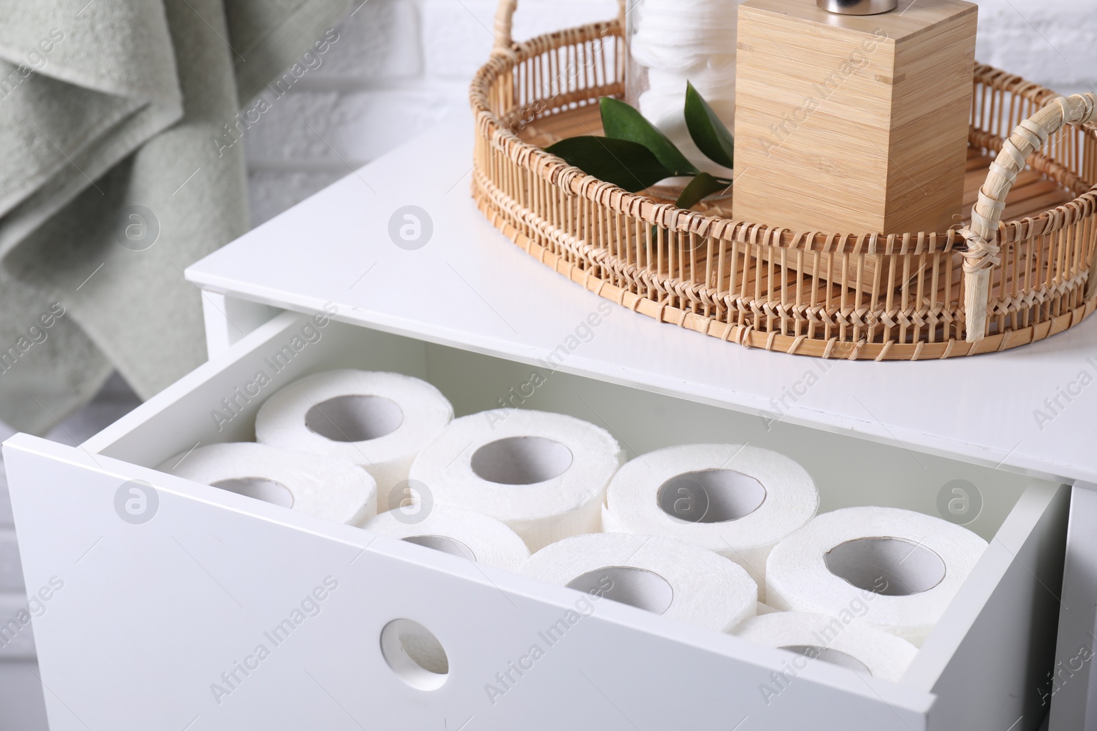 Photo of Many toilet paper rolls in white drawer indoors