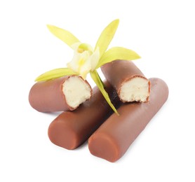 Photo of Glazed curd cheese bars and vanilla flower isolated on white