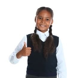 Photo of Happy African-American girl in school uniform on white background