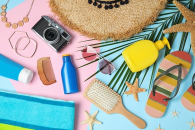 Photo of Flat lay composition with beach accessories on colorful background