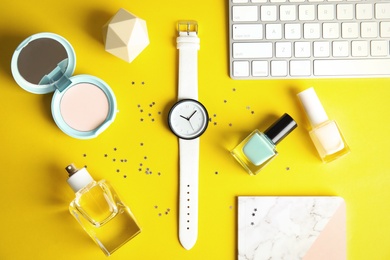 Photo of Flat lay composition with stylish wrist watch on table. Fashion accessory