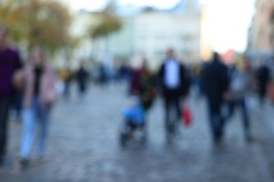 Blurred view of people walking on city street