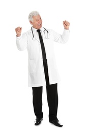 Photo of Full length portrait of happy male doctor isolated on white. Medical staff