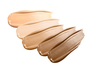 Image of Foundation of various shades for different skin tones isolated on white, top view. Set of samples