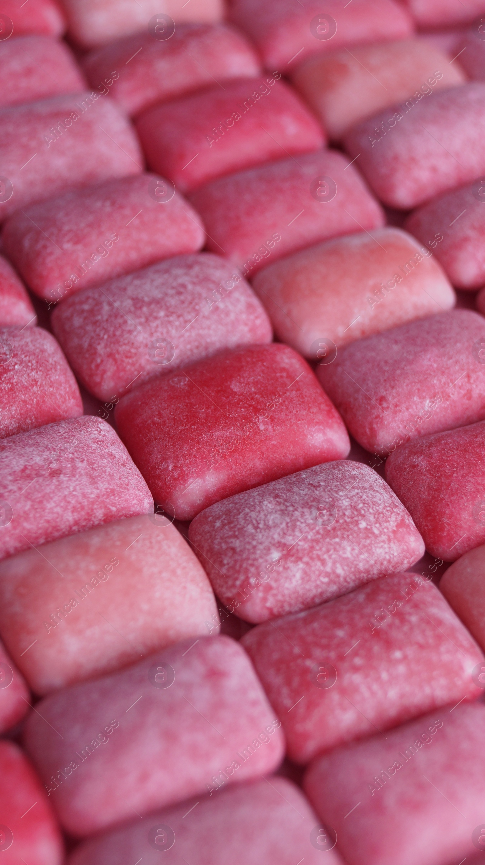 Photo of Many pink chewing gums as background, closeup