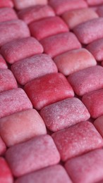 Many pink chewing gums as background, closeup