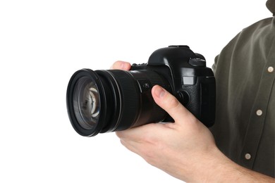 Photo of Photographer holding modern camera on white background, closeup