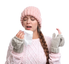 Young woman suffering from cold on white background