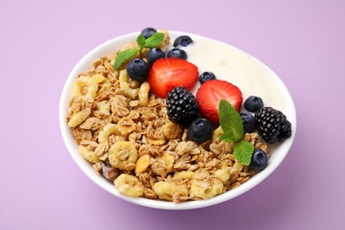 Photo of Tasty oatmeal, yogurt and fresh berries in bowl on lilac background, closeup. Healthy breakfast