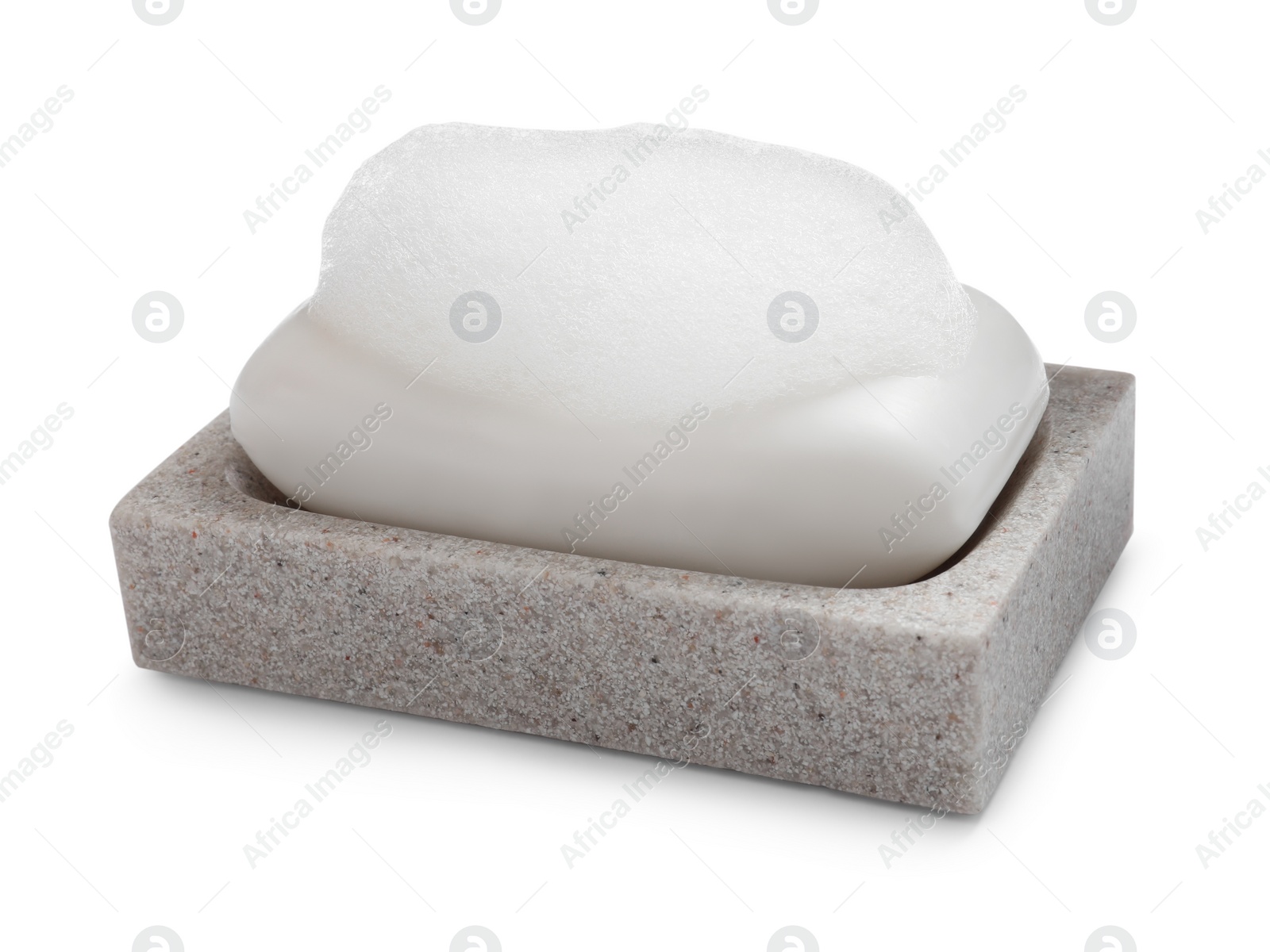 Photo of Soap bar with fluffy foam in holder on white background