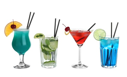 Photo of Tasty refreshing cocktails in glasses on white background