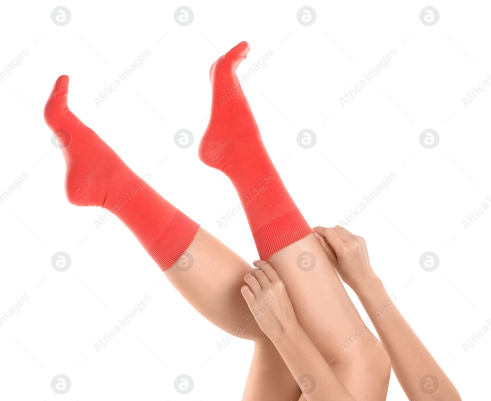 Photo of Woman putting on stylish socks on white background, closeup