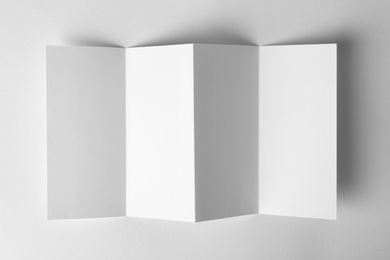 Photo of Blank brochure mock up on white background, top view