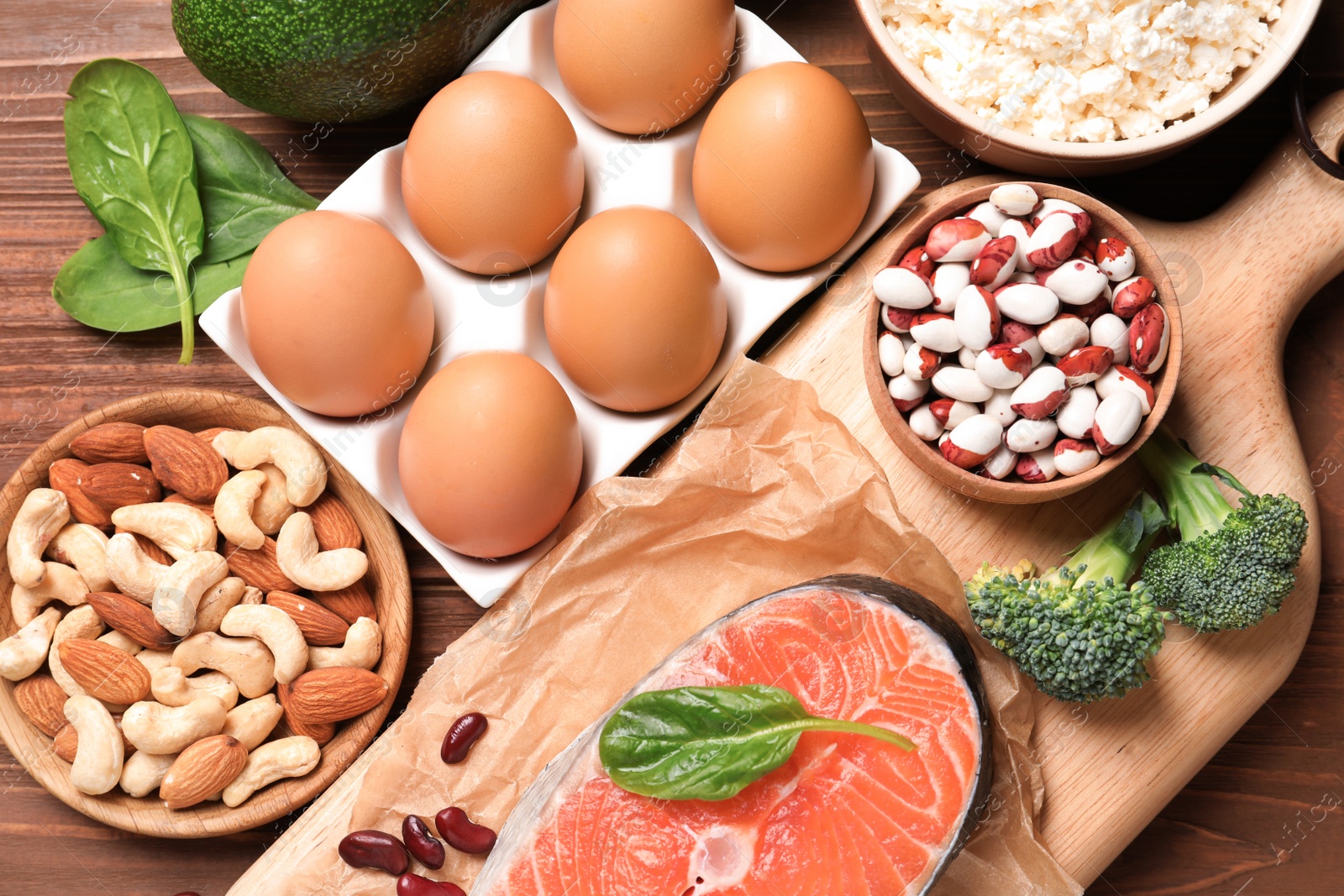 Photo of Set of natural protein food on wooden background, top view