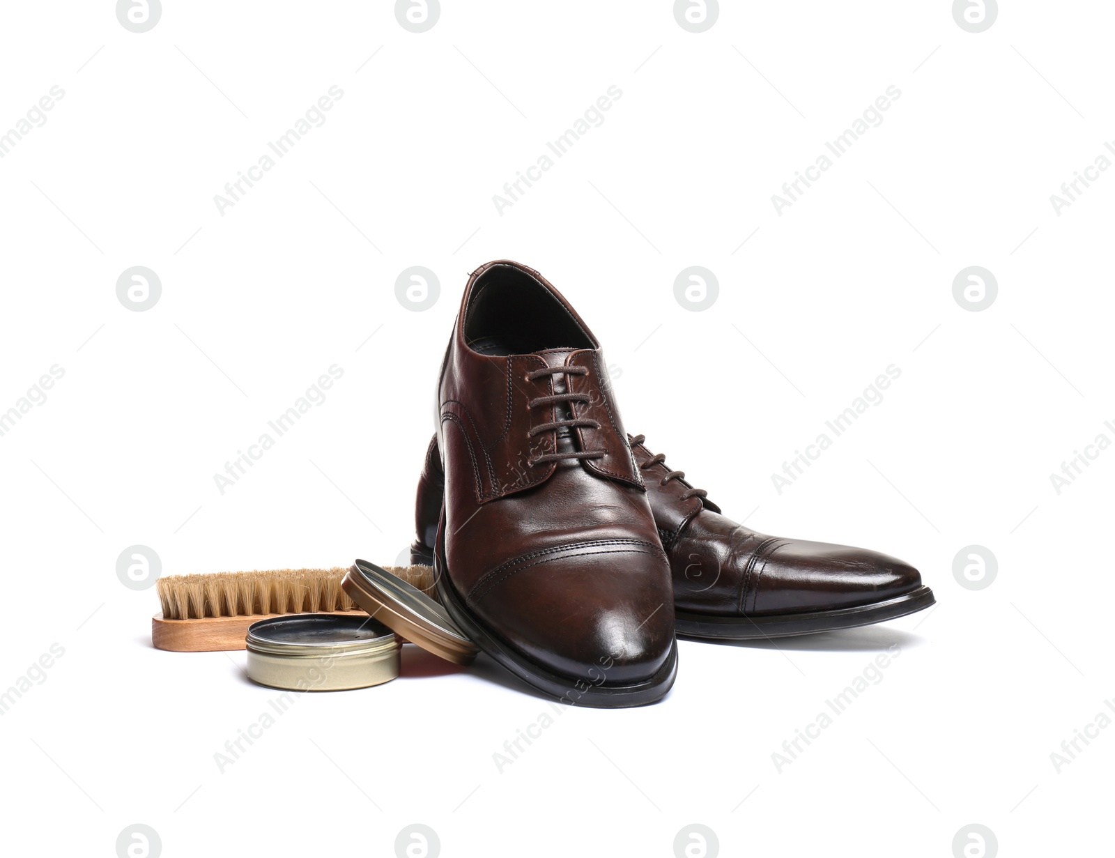 Photo of Stylish men's footwear and shoe care accessories on white background