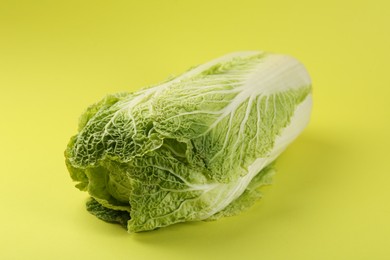 Fresh ripe Chinese cabbages on pale yellow background, closeup