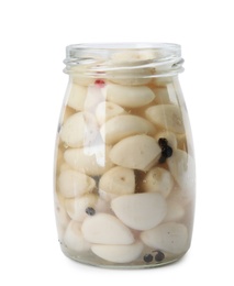 Jar with pickled garlic on white background