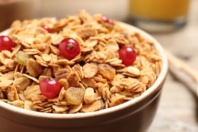 Muesli with berries in bowl, closeup. Delicious breakfast