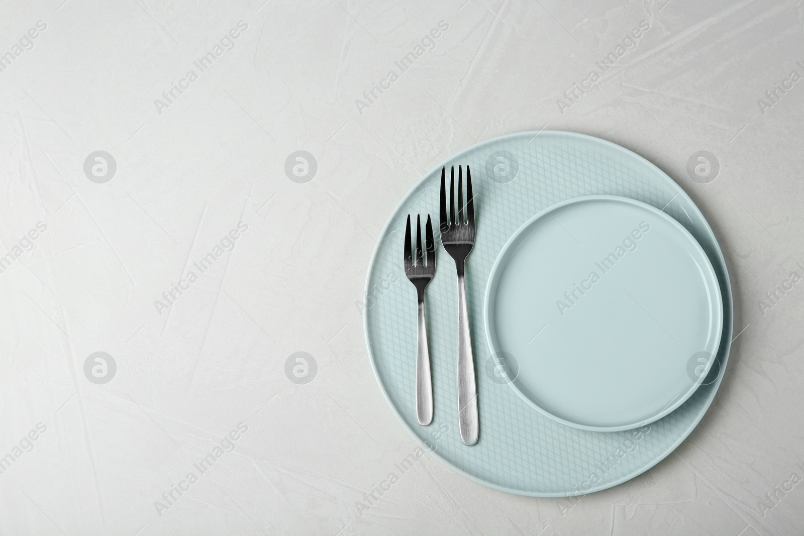 Photo of Beautiful table setting on grey background, top view. Space for text