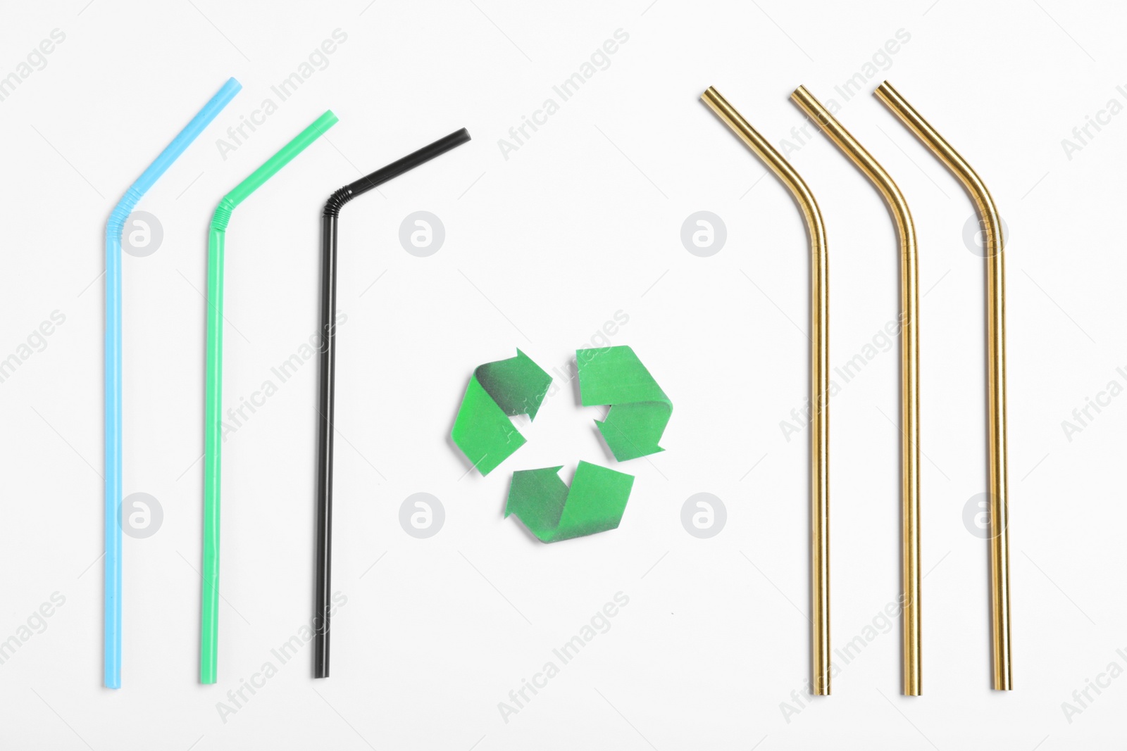 Photo of Recycling symbol, plastic and metal drinking straws on white background, top view