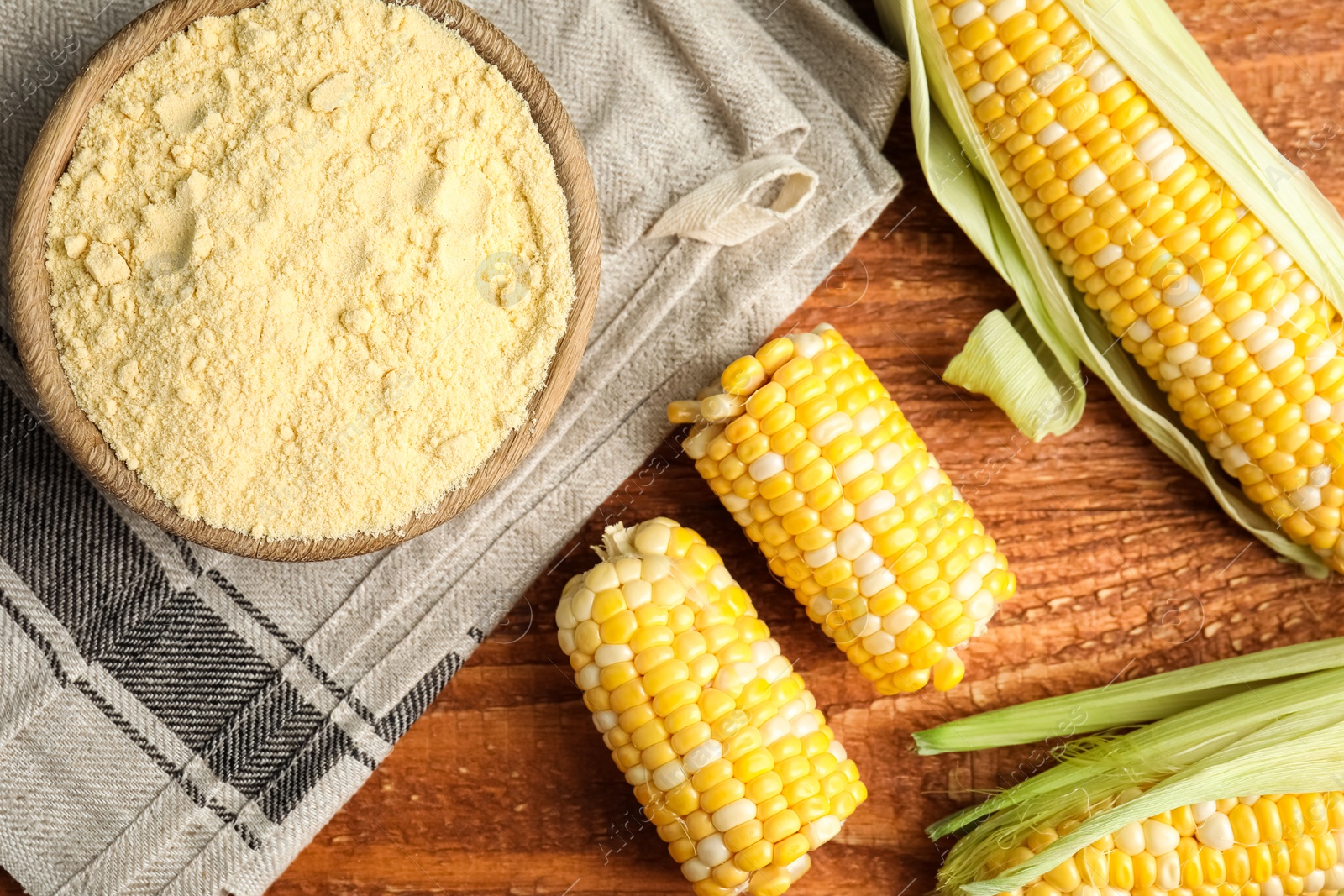 Photo of Flat lay composition with corn flour on wooden table