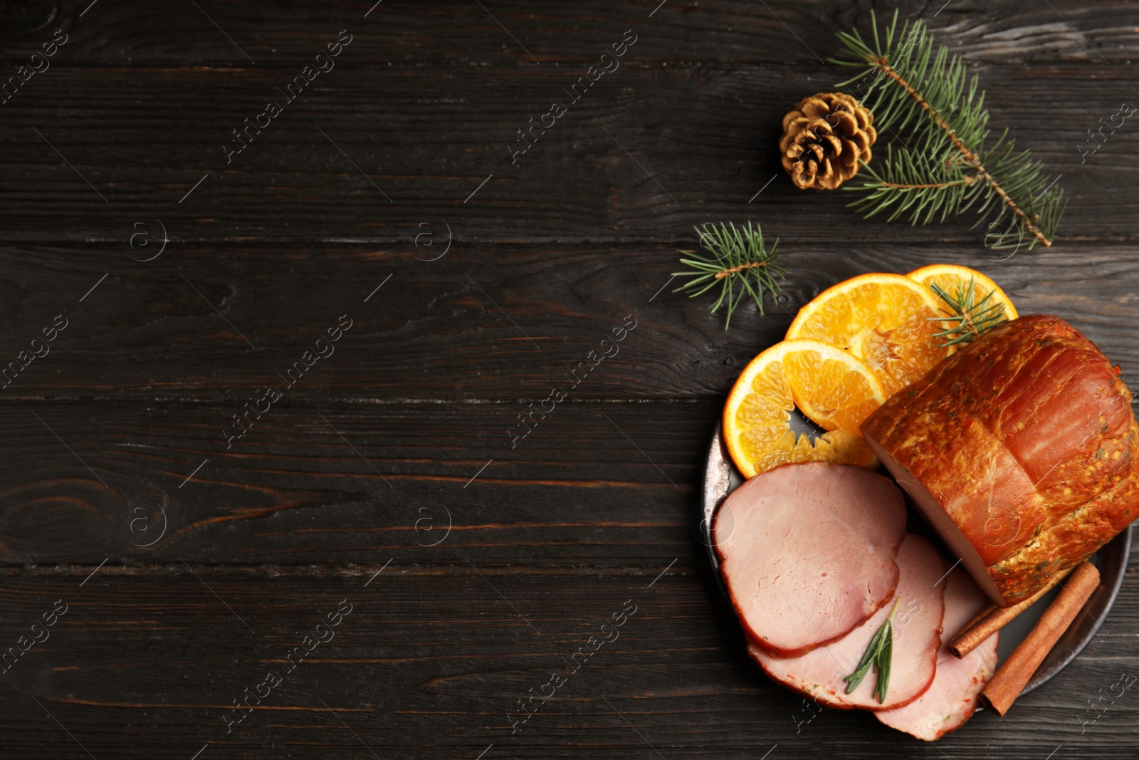 Photo of Flat lay composition with delicious ham on black wooden table, space for text. Christmas dinner