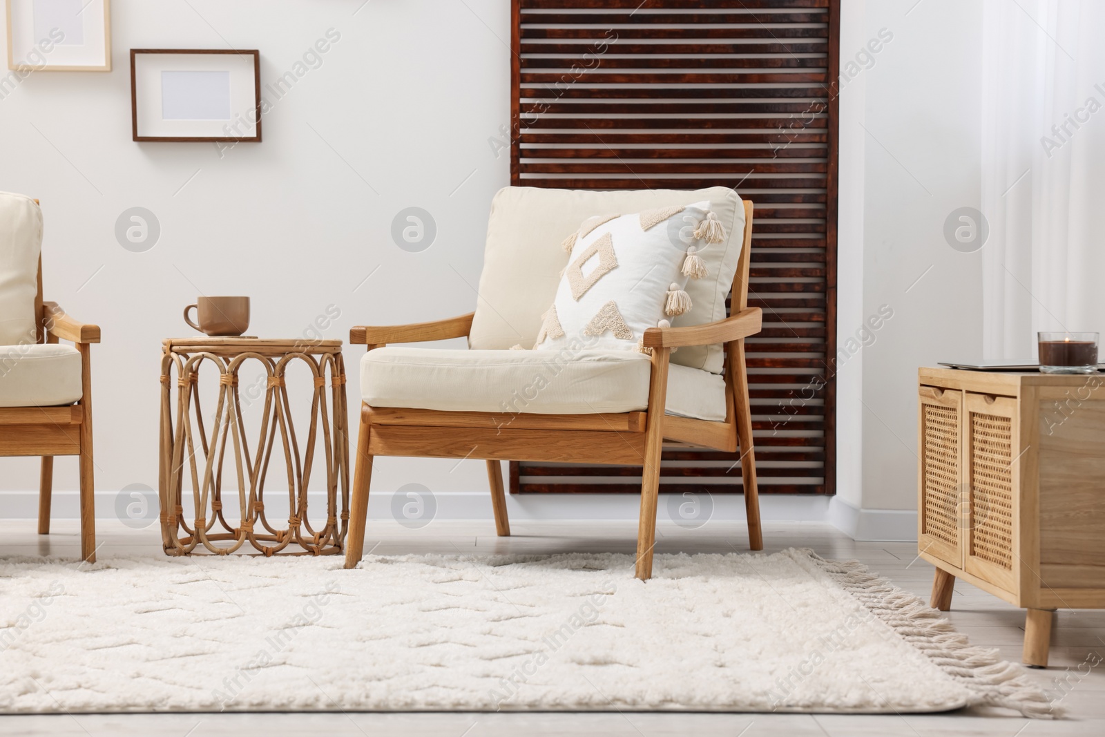 Photo of Stylish living room with soft white carpet and furniture. Interior design