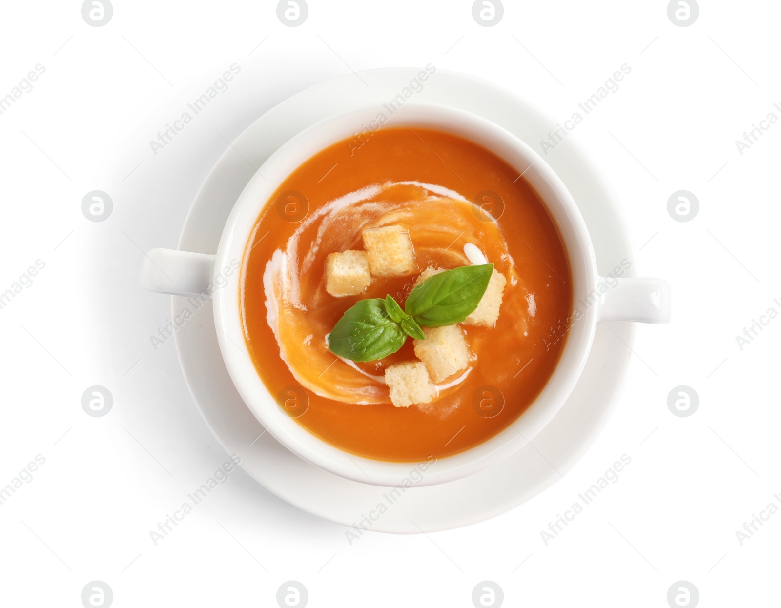 Photo of Bowl of tasty sweet potato soup isolated on white, top view