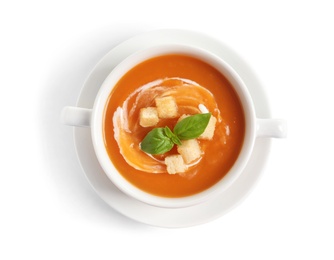 Photo of Bowl of tasty sweet potato soup isolated on white, top view