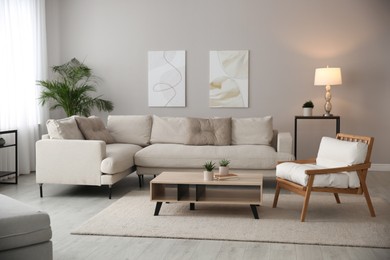 Photo of Big comfortable sofa in living room. Interior design