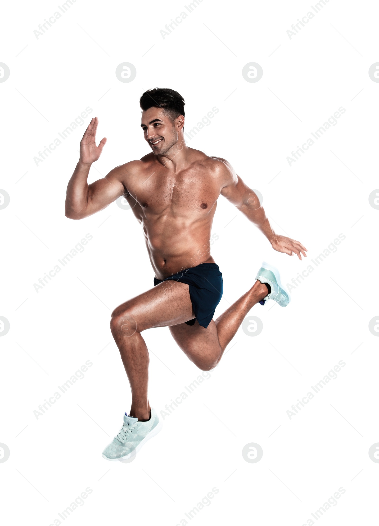 Photo of Handsome young man running on white background